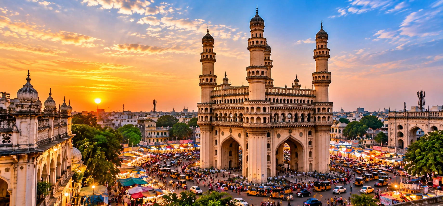 Charminar Hyderabad panoramic view at sunset, featuring historic minarets, bustling markets, and vibrant streets of Telangana, India.
